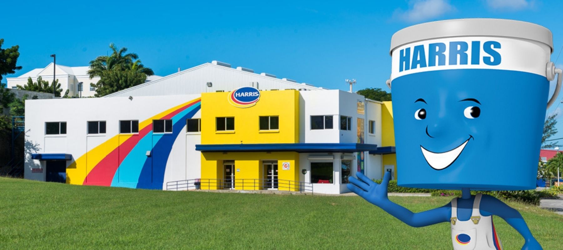 Harris Paints manufactuing facility with little blue man overlayed on top waving